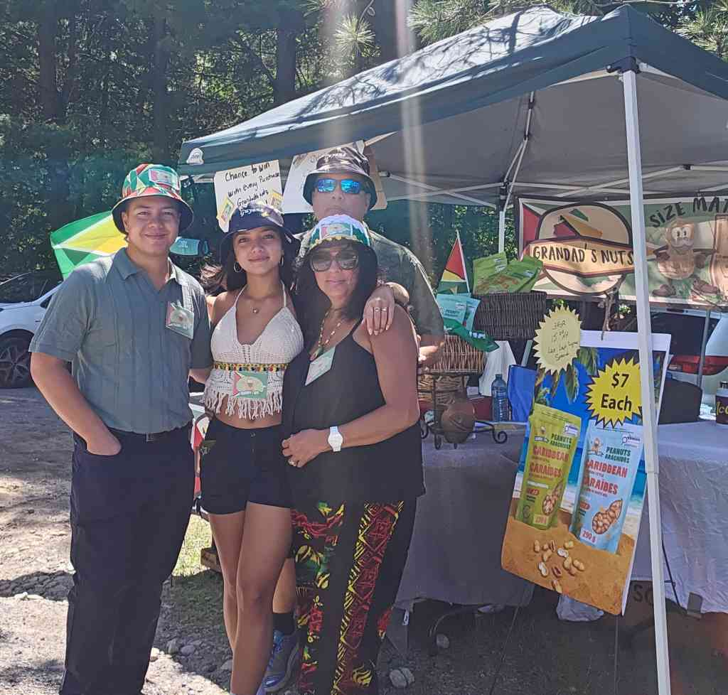 The family at a summer Grandad's Nuts market booth
